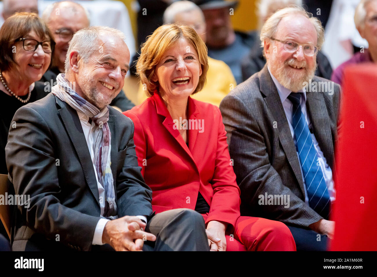 Berlin, Germany. 27th Sep, 2019. Klaus Jensen (SPD, l), husband of Malu Dreyer, Malu Dreyer, provisional SPD chairwoman and prime minister of Rhineland-Palatinate, and Wolfgang Thierse (SPD), former vice-president of the German Bundestag, laugh in the Willy Brandt House at the award of the August Bebel Prize to Malu Dreyer. The August Bebel Foundation was founded in 2010 by Günter Grass and honours people who, like August Bebel, have rendered outstanding services to the social movement in Germany. Credit: Christoph Soeder/dpa/Alamy Live News Stock Photo
