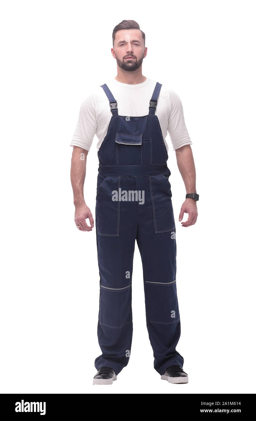 confident young man in blue overalls . isolated on white Stock Photo