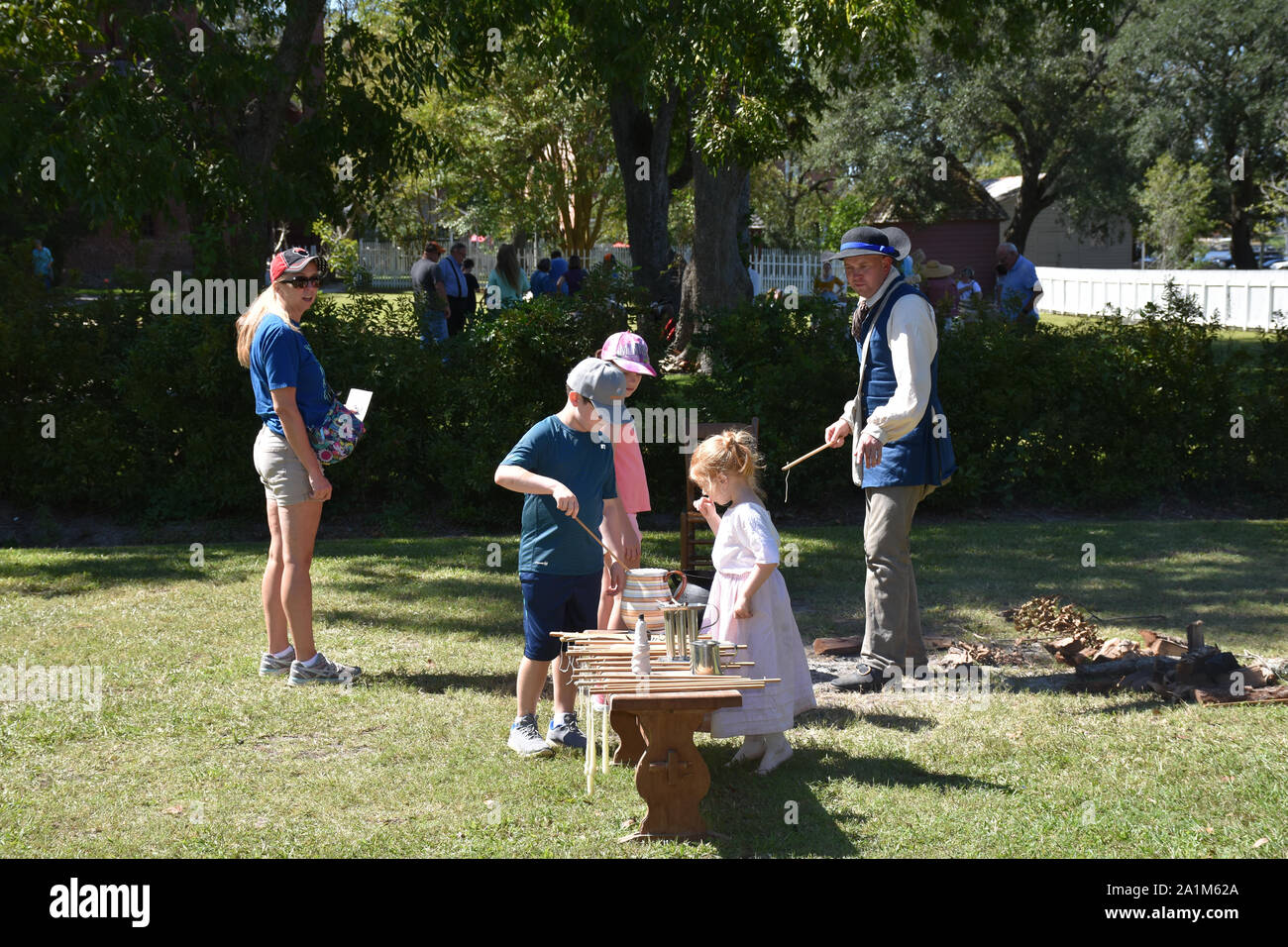 A demonstration of how candles were made in Colonial times Stock Photo