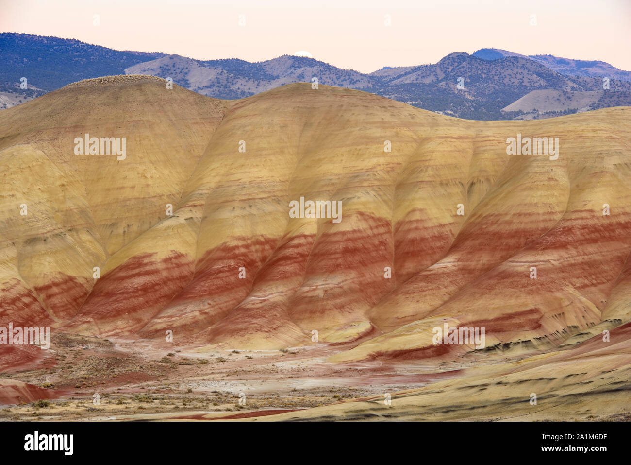 Eroded laterite and mudstone sediments in a sagebrush environment, John Day Fossil Beds National Monument, Painted Hills Unit, Mitchell, Oregon, USA Stock Photo
