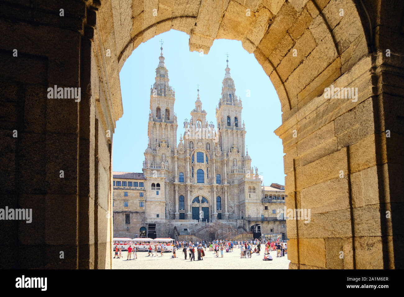 SANTIAGO DE COMPOSTELA, SPAIN - JULY 2019: Tourists and pilgrims near the Cathedral of Santiago de Compostela, famous Spanish town at the end of Camin Stock Photo