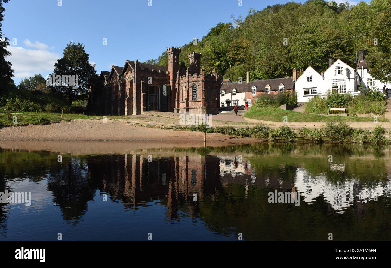 The Museum of the Gorge also know as the Gothic Warehouse alongside the River Severn in Ironbridge, Shropshire, England, Uk Stock Photo