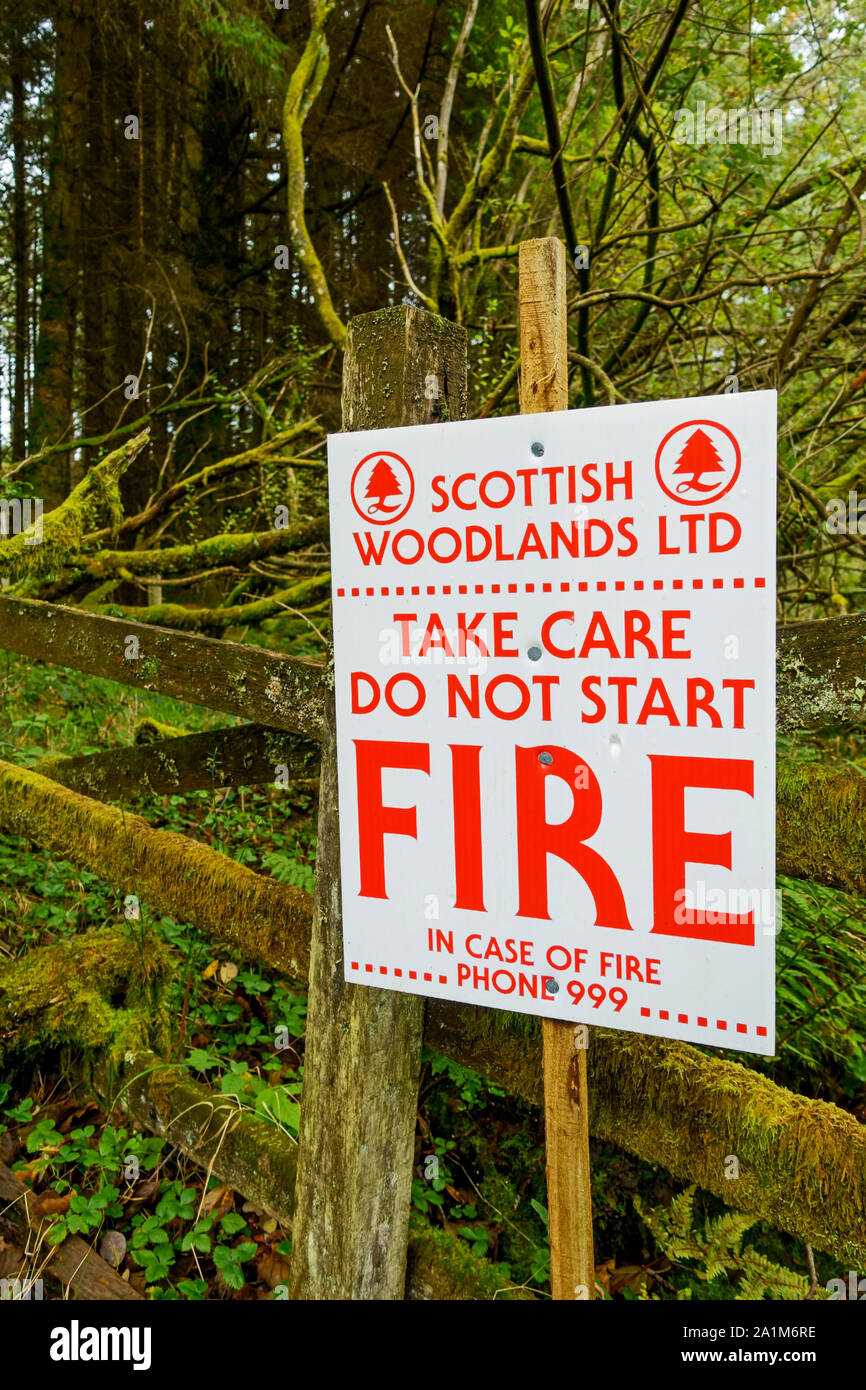 Fire warning sign next to a track in woodland in Dumfries and Galloway, Scotland, UK Stock Photo