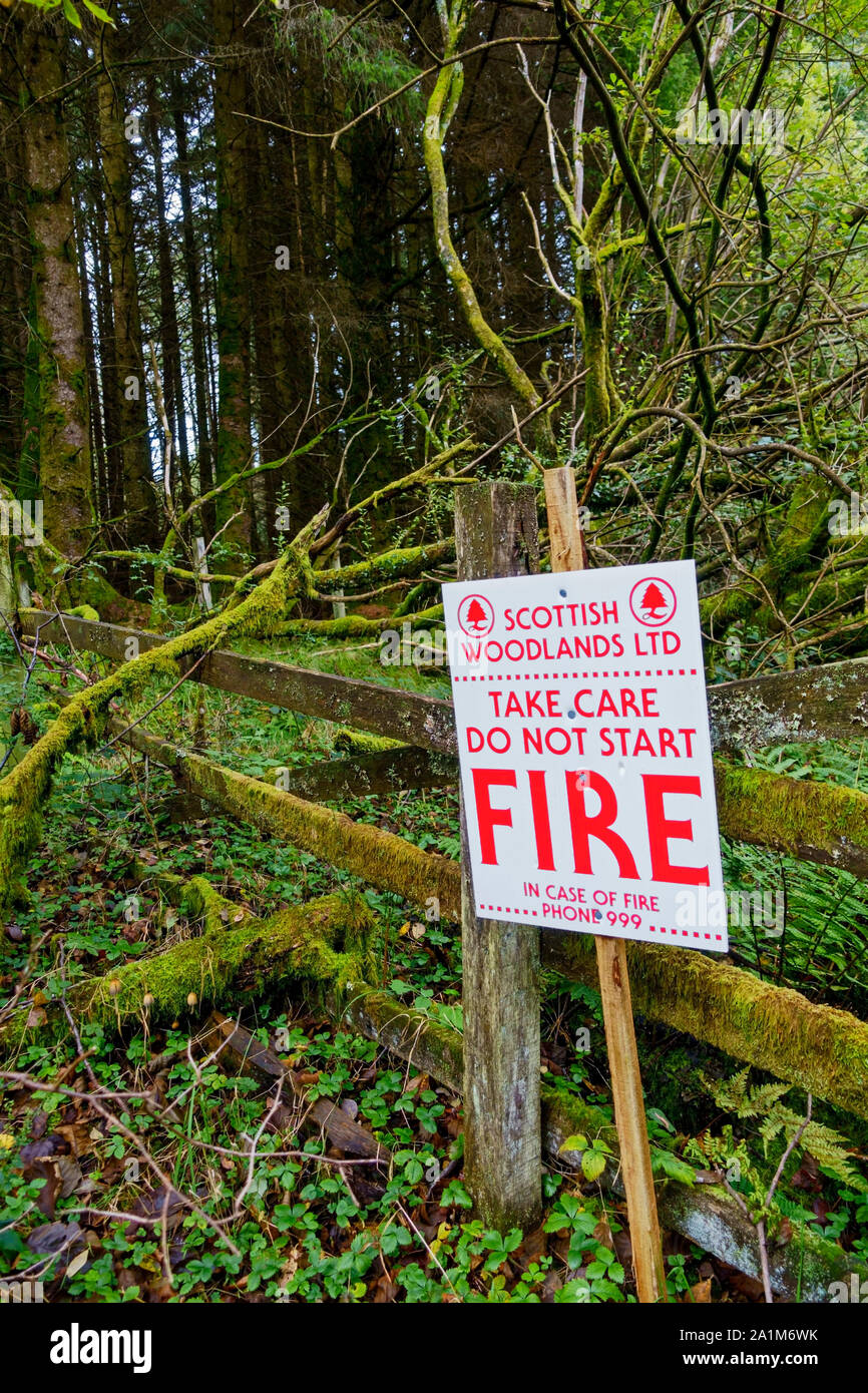 Fire warning sign next to a track in woodland in Dumfries and Galloway, Scotland, UK Stock Photo