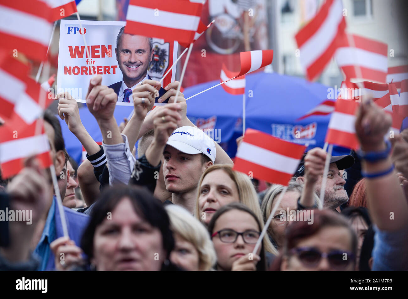Supporters with Austrian flags listening to Norbert Hofer, during a campaign event ahead of Sunday's snap parliamentary elections.On September 29, 2019 parliamentary elections will take place as a result of a hidden-camera footage where OeVP's coalition partner, the far-right Freedom Party (FPOe) was caught up in a corruption scandal and brought the government down. Stock Photo