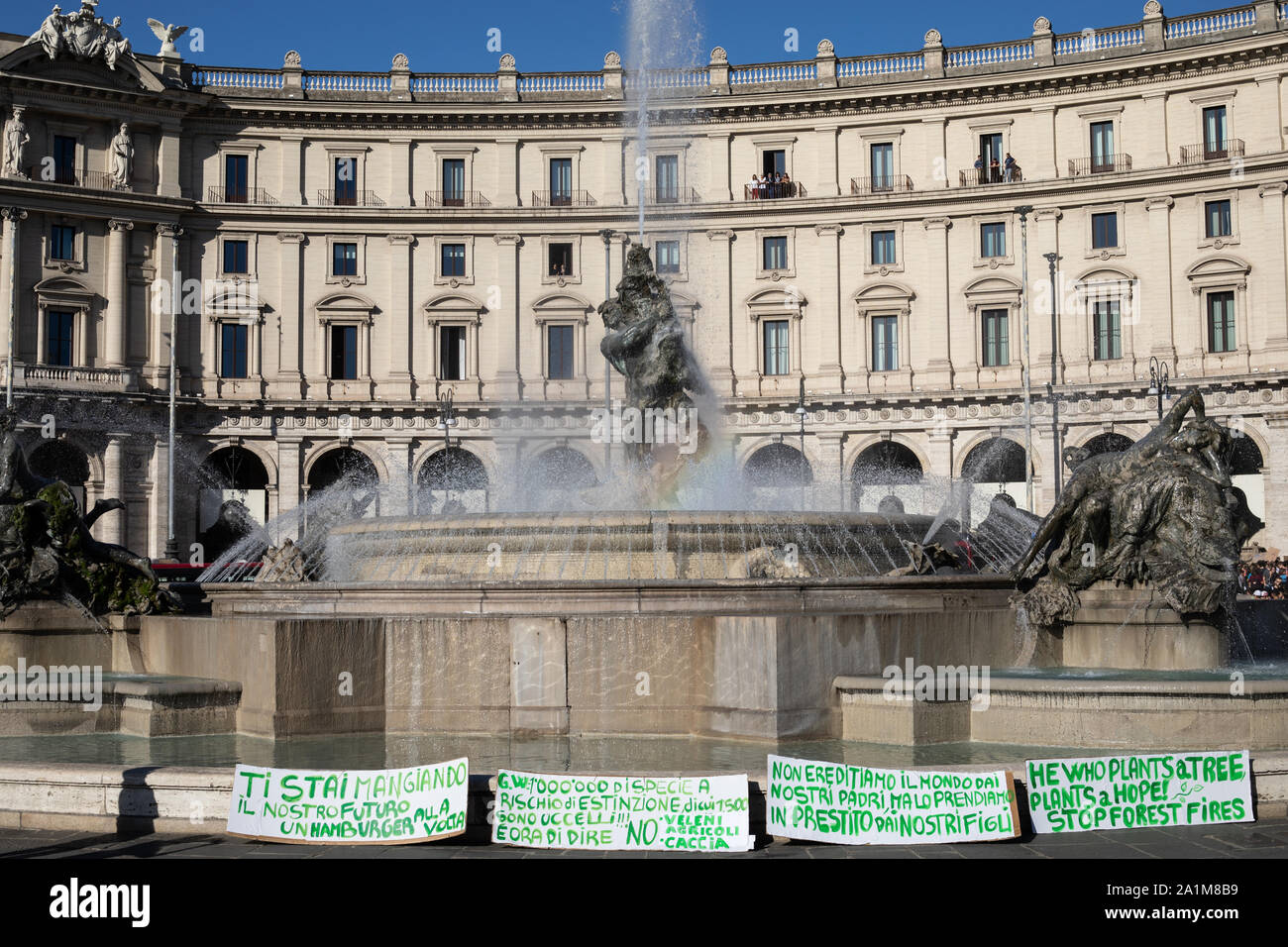 Placards at the fountain of the Naiads in piazza della repubblica during the protest.Friday for the future: an international demonstration of the earth that with great student participation started from Piazza della Repubblica to Piazza Madonna di Loreto (Piazza Venezia) in Rome. Stock Photo