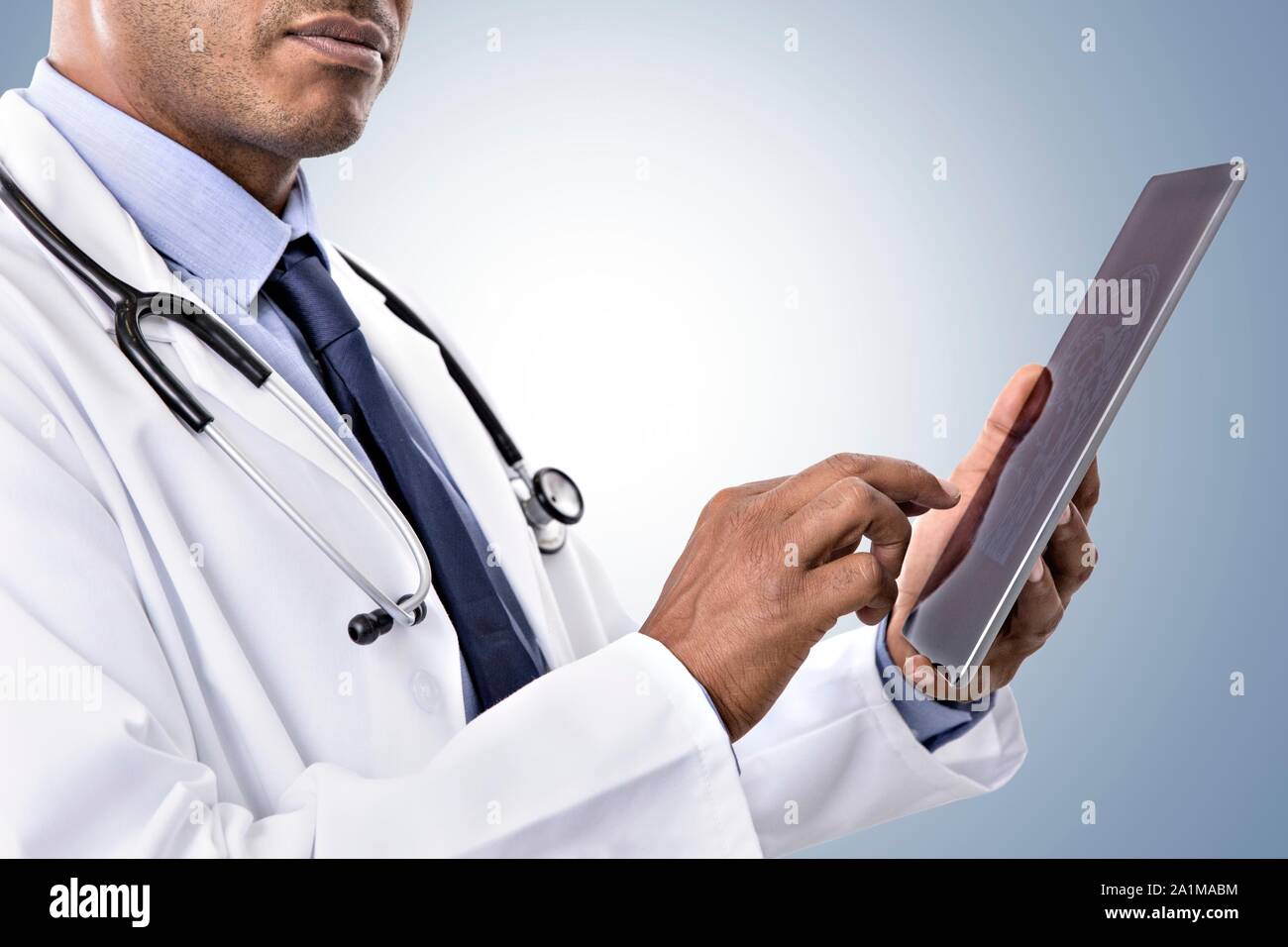 Male doctor using digital tablet. Stock Photo