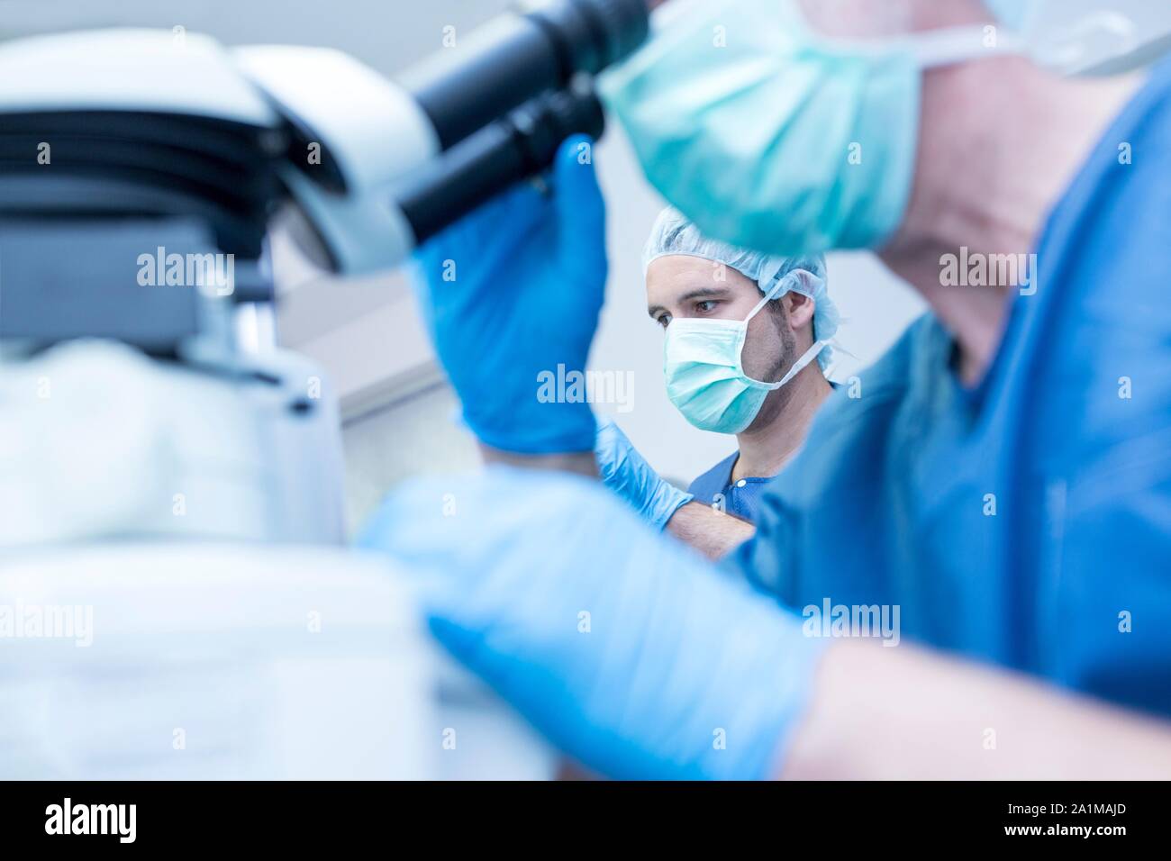 Surgical team performing laser eye surgery. Stock Photo
