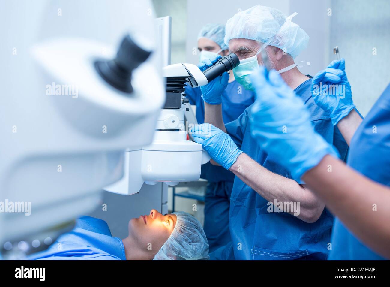 Surgical team performing laser eye surgery Stock Photo Alamy