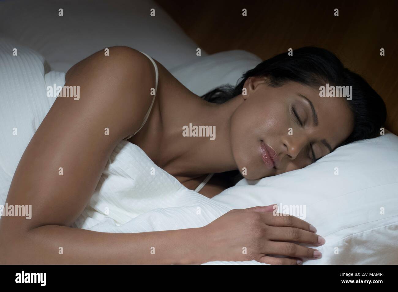 Woman sleeping in bed. Stock Photo
