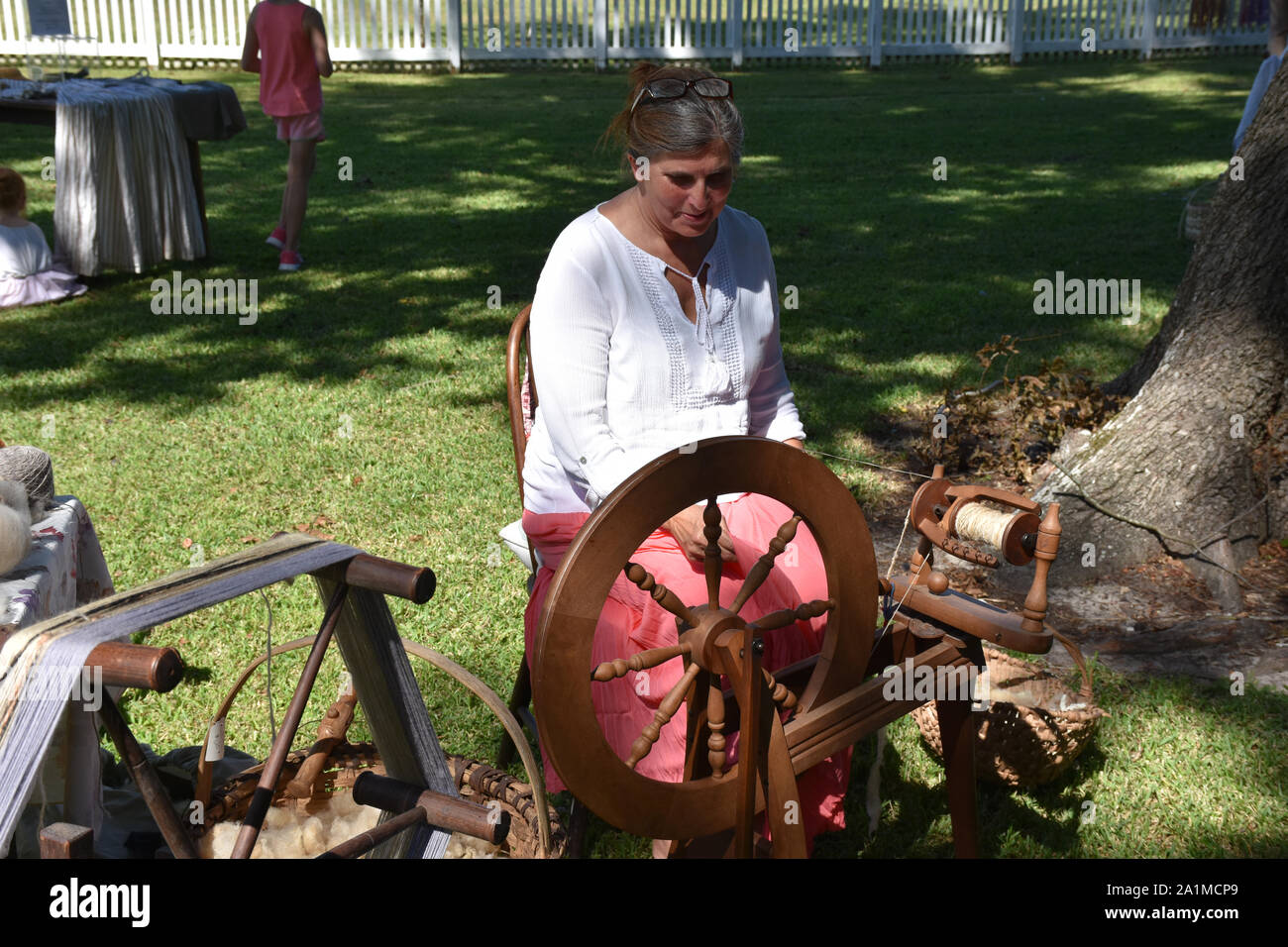 A demonstration of how a spinning wheel was used in colonial times