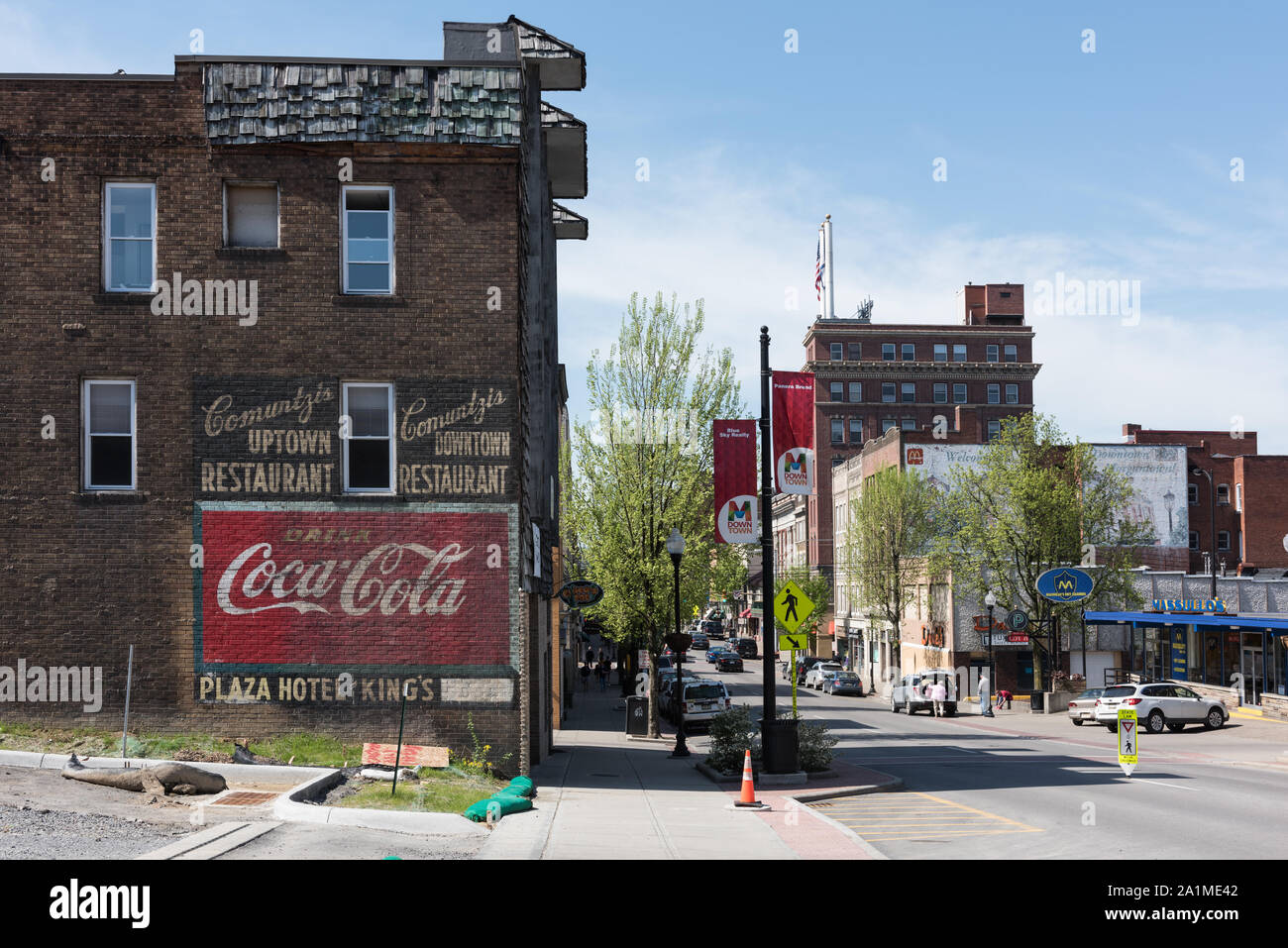 Old CocaCola and local restaurant signs on a wall in downtown