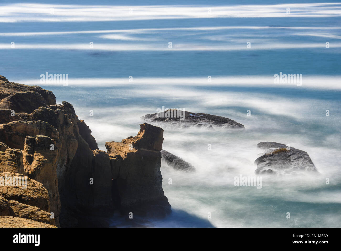 Rugged coastline with pounding surf, Devil's Punchpbowl Viewpoint, Oregon, USA Stock Photo