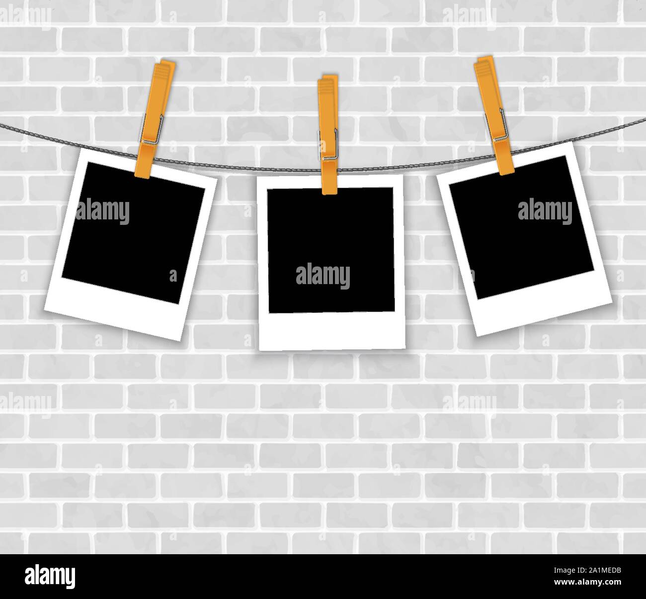 photo frames on rope with clothespins on brick wall vector Stock Vector