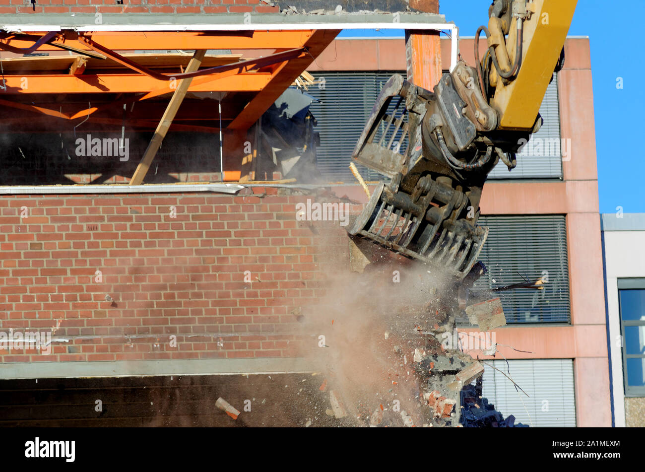 demolition work with an excavator on a house Stock Photo