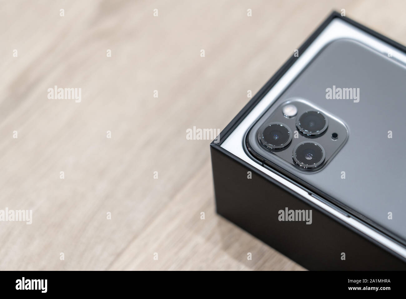 Moscow, Russia - September 24, 2019: new Apple iPhone 11 pro in box on wooden background Stock Photo