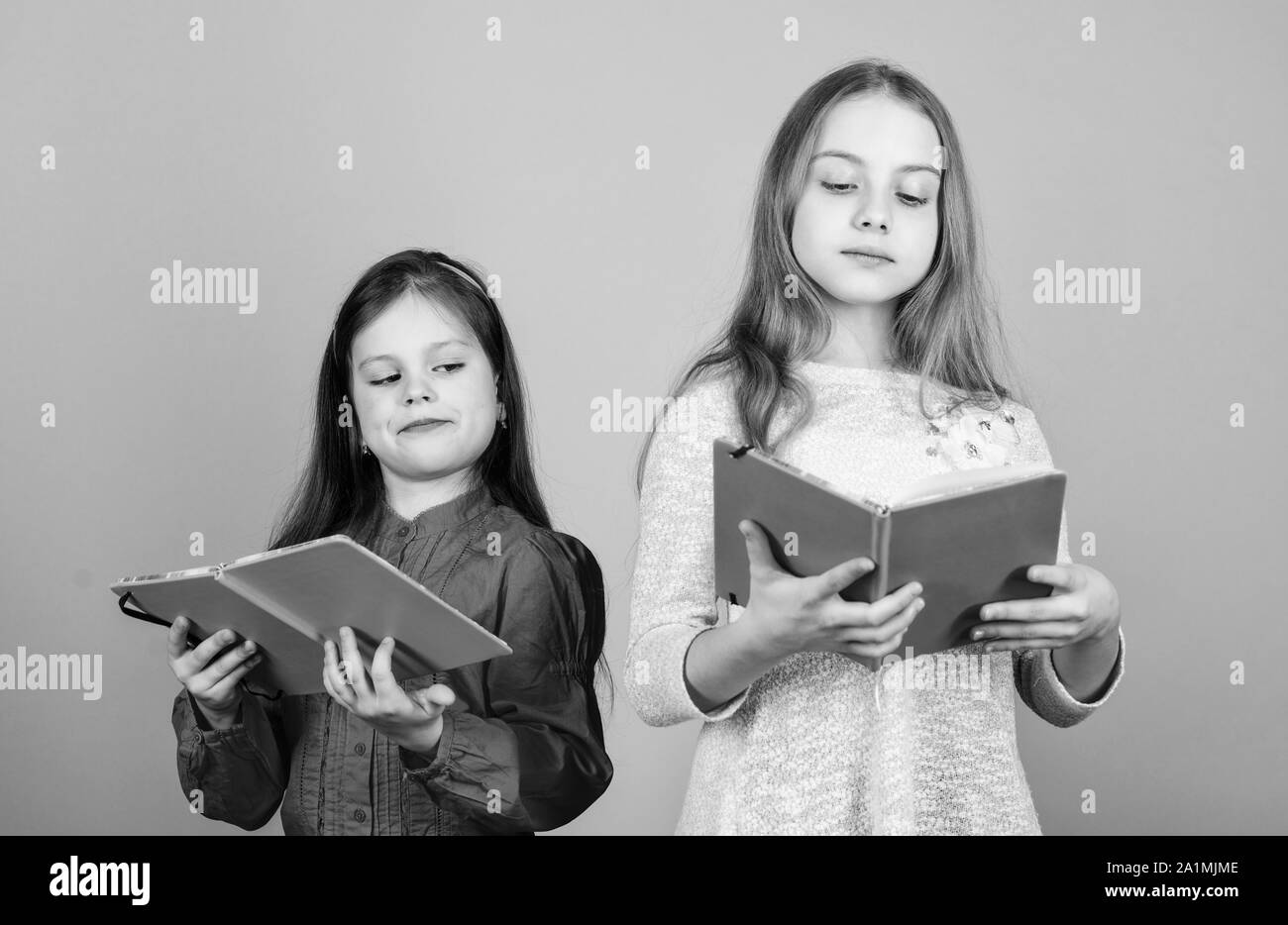 Sisters Pick Books To Read Together Adorable Girls Love Books Secret Diary Opening Doors Through Literacy Kids Girls With Books Or Notepads Education And Kids Literature Favorite Fairytale Stock Photo Alamy