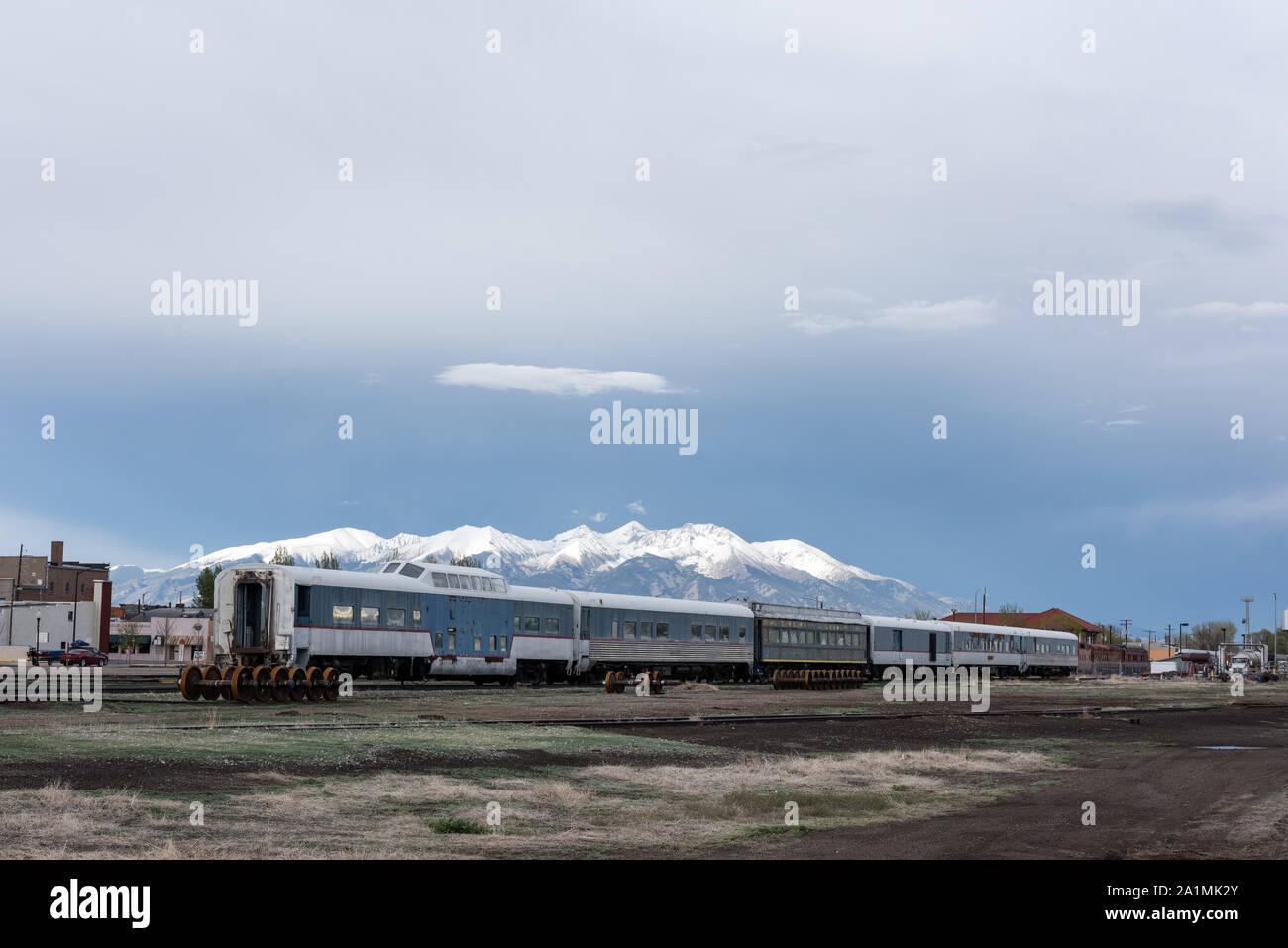 Old train cars, including a dome car observation coach, part of the
