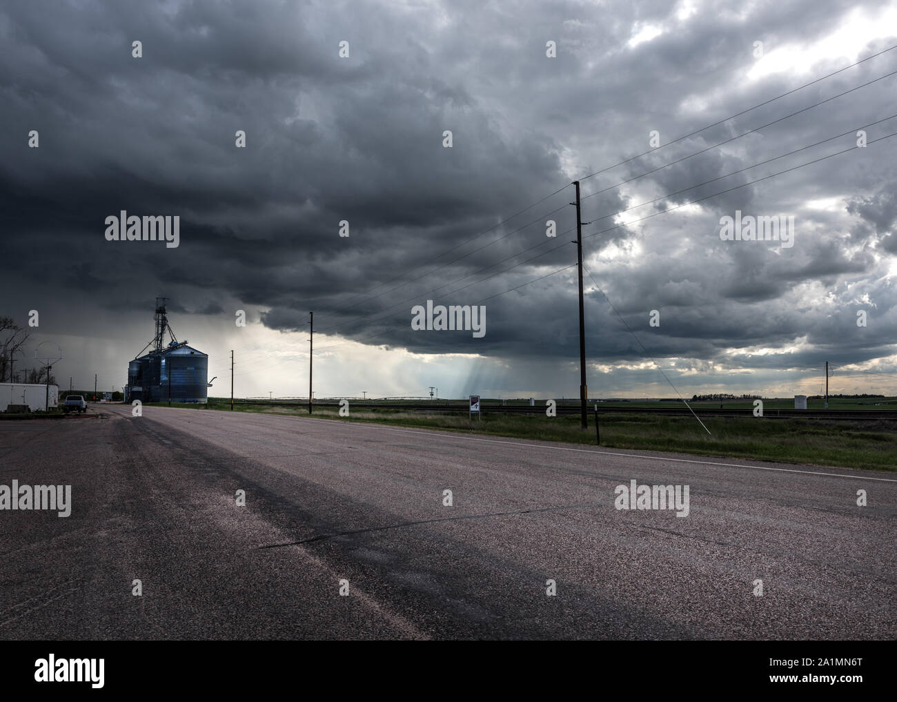 Ominous clouds above Pine Bluffs, a small farming community on the Nebraska border in Laramie County, Wyoming Stock Photo