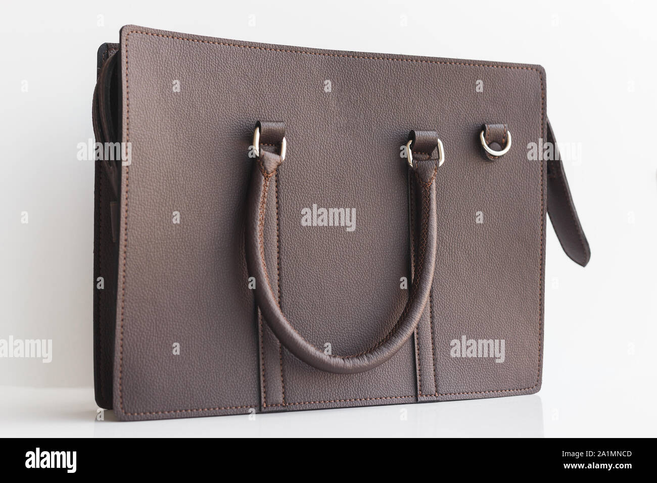 Brown genuine leather unisex office bag on white background Stock Photo