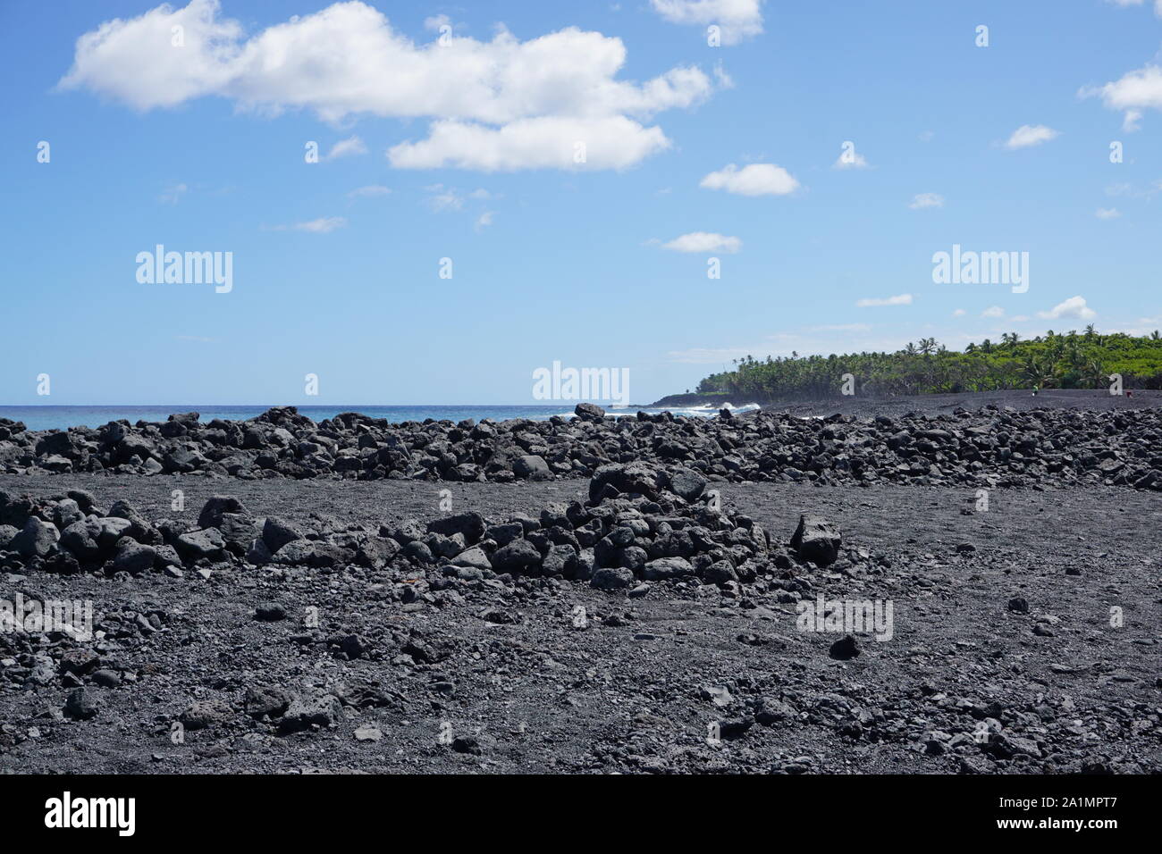 Pohoiki Black Sand Beach in Isaac Hale Beach Park in Hawaii - Hawaii's newest beach, created by the 2018 eruptions of Kilauea. Stock Photo