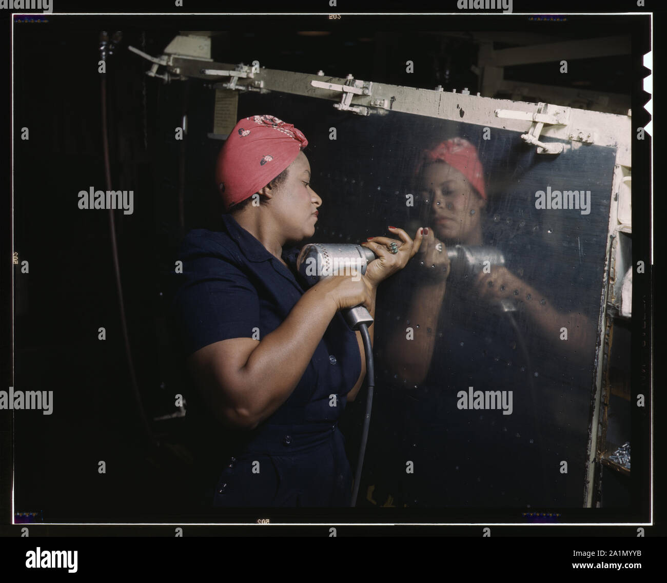 A reallife Rosie the Riveter operating a hand drill at Vultee