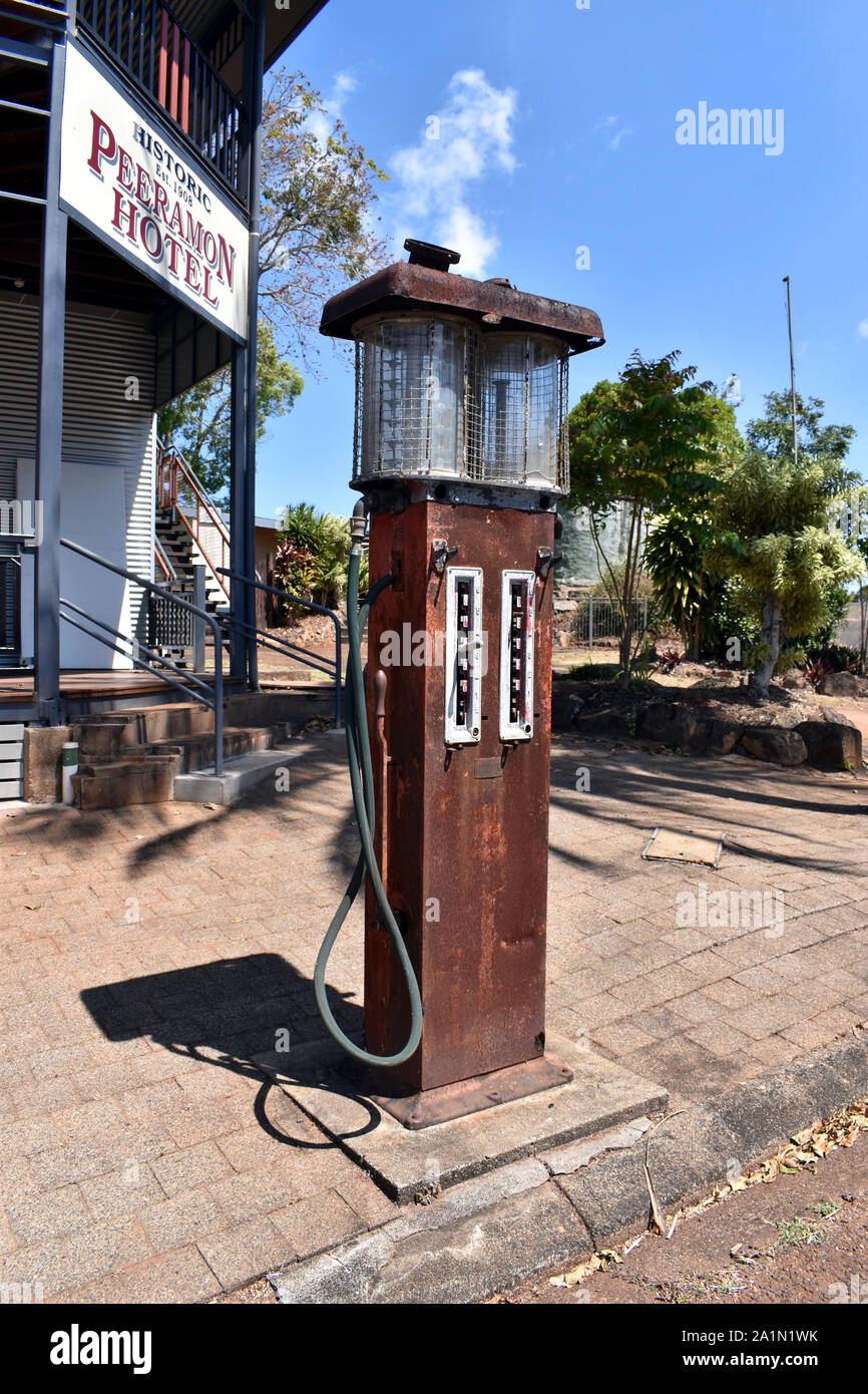 A antique double petrol bowser standing outside the historic 1908 Peeramon Hotel. Stock Photo