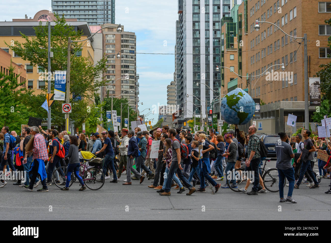 Demonstrators march through downtown Toronto during the Global Climate Strike on September 27, 2019. Stock Photo