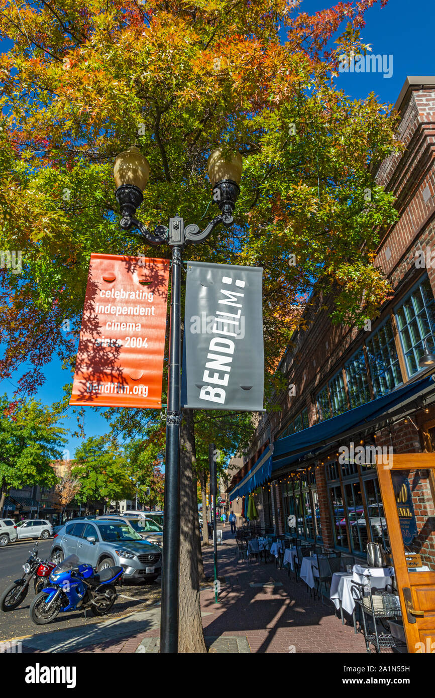 Oregon, Bend, Downtown, Wall Street, Film Festival banner, sidewalk restaurant, fall season Stock Photo