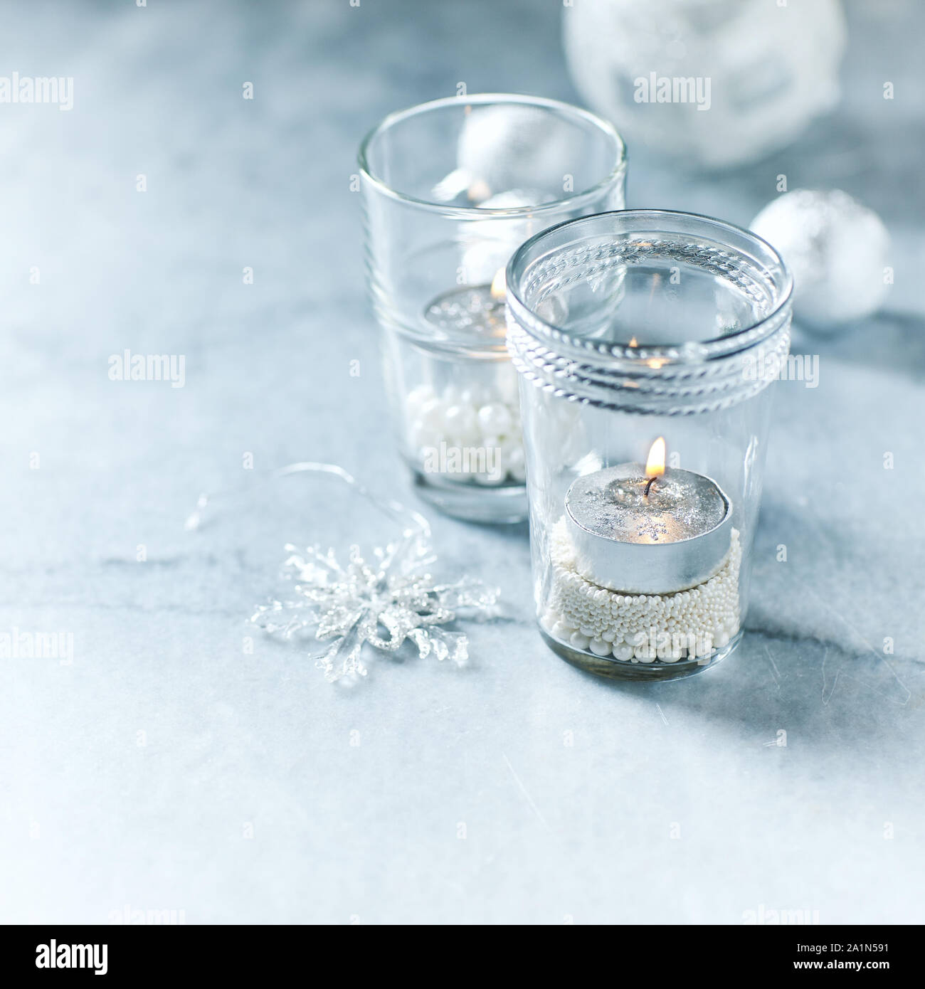 Christmas candle holders made of glasses with sugar pearls Stock Photo