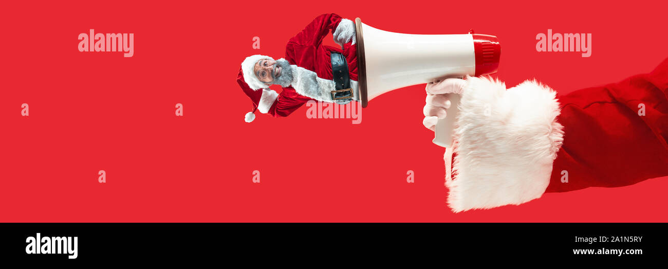 Happy Christmas Santa Claus on red studio background. Caucasian male ...