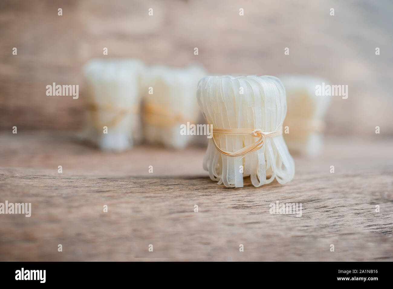 Asian uncooked noodles, tied with natural rope. Asian food concept ...