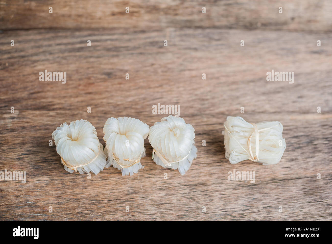 Asian uncooked noodles, tied with natural rope. Asian food concept ...