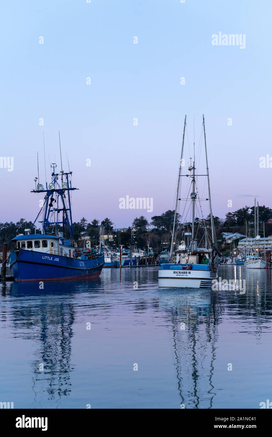 Fishing boats docked at Newport Harbor in Coastal Oregon, USA Stock Photo