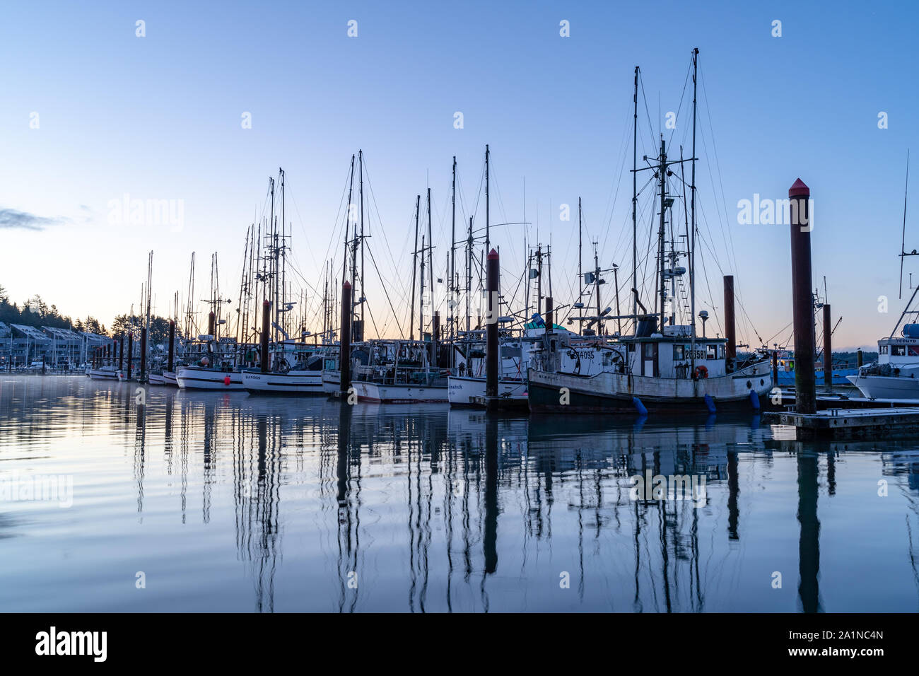 Fishing boats docked at Newport Harbor in Coastal Oregon, USA Stock Photo