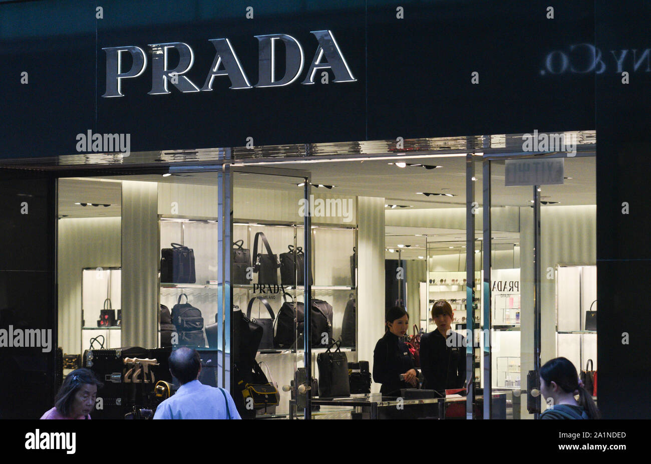 STRICTLY NO SALES TO FRENCH MEDIA OR PUBLISHERS *** September 27, 2019 -  Hong Kong, China: People walk by the Prada flagship store in Russell Street  in Hong Kong. The Italian