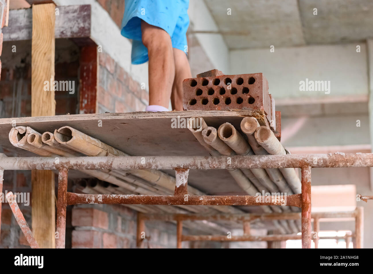 plasterer making up a brick wall Stock Photo