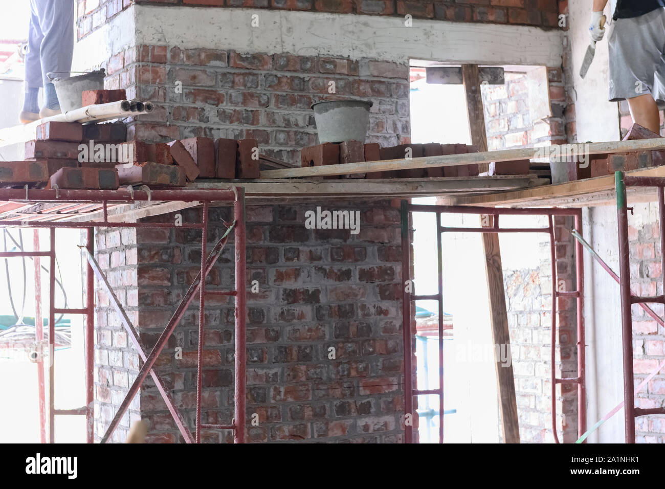 plasterers making up brick walls Stock Photo