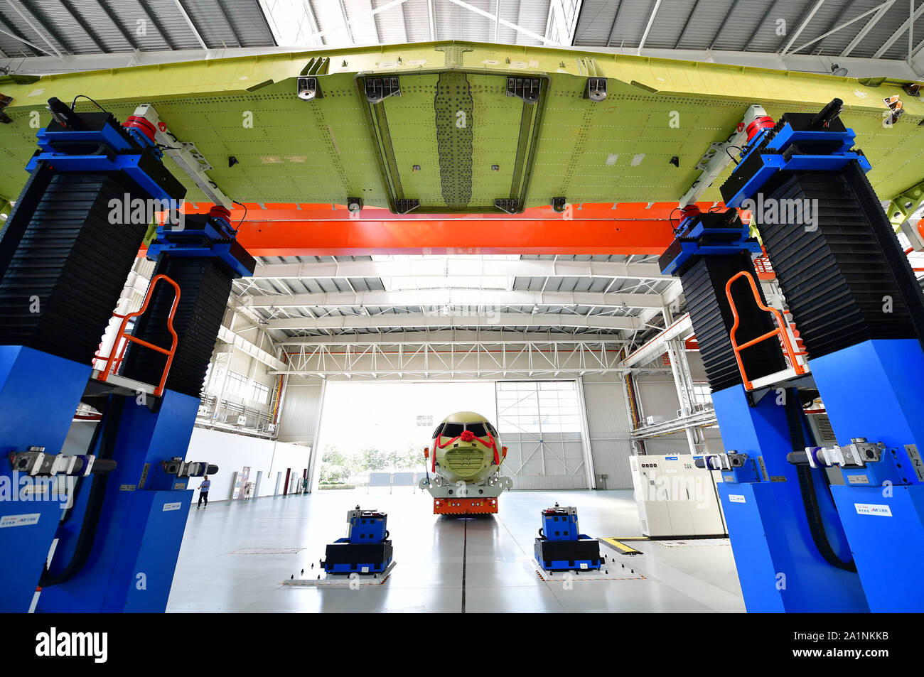 Beijing, China's Shaanxi Province. 27th Sep, 2019. Engineers make preparations to join the wings with the fuselage of a Xinzhou-700 short-haul aircraft, manufactured by the Xi'an Aircraft Industry Company (XAC) of the Aviation Industry Corporation of China, in Xi'an, northwest China's Shaanxi Province, Sept. 27, 2019. Credit: Shao Rui/Xinhua/Alamy Live News Stock Photo