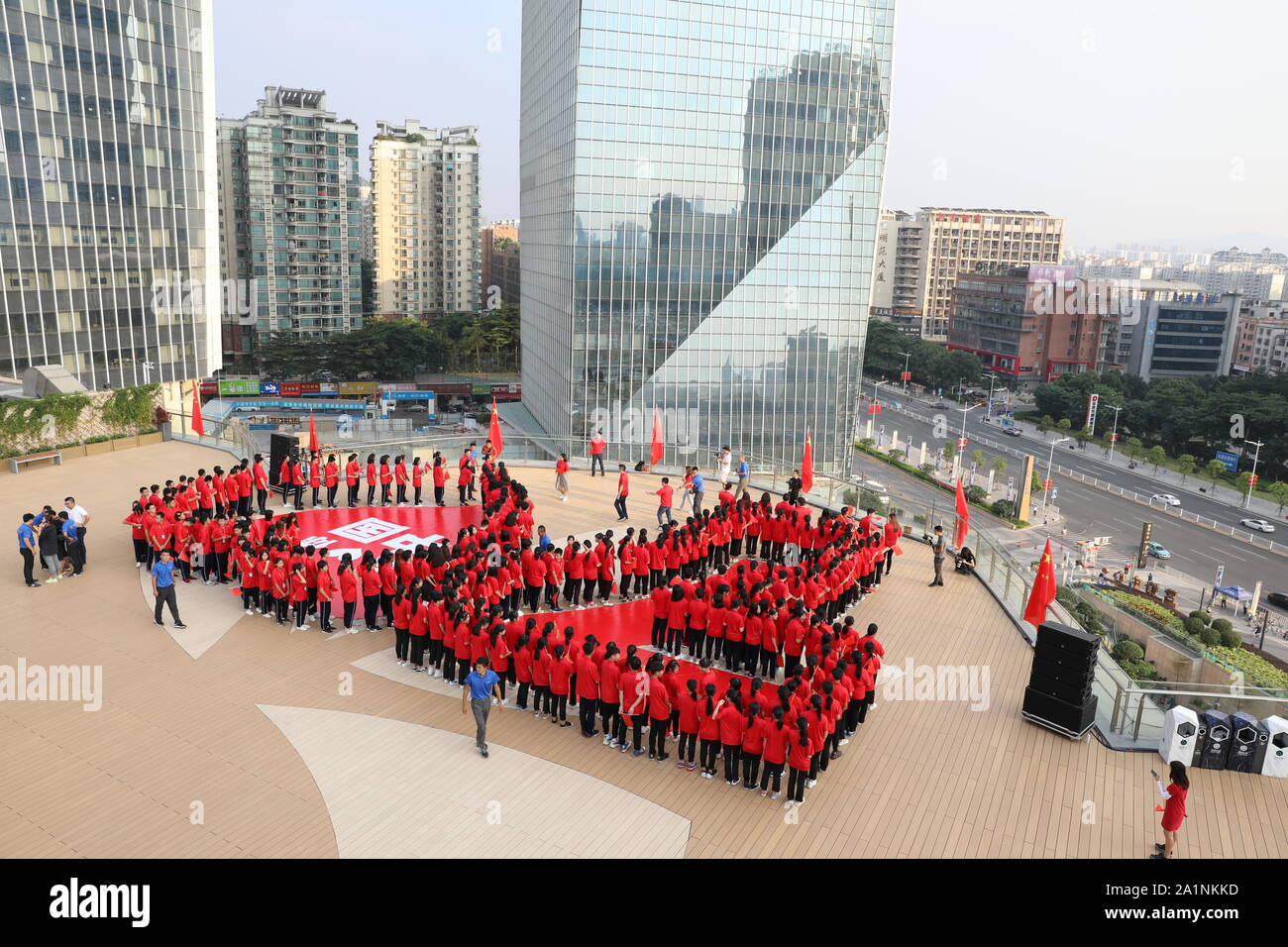 Beijing, China's Guangdong Province. 26th Sep, 2019. People stand in a formation showing the number '70' during a theme event celebrating the 70th anniversary of the founding of the People's Republic of China (PRC) at Dongguan International Trade Center in Dongguan, south China's Guangdong Province, Sept. 26, 2019. Credit: Li Jiale/Xinhua/Alamy Live News Stock Photo