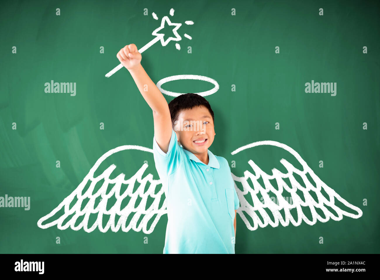 happy asian boy standing against chalkboard and magic concept Stock ...