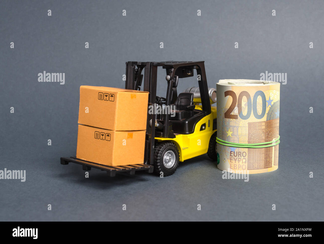 A forklift truck carries cardboard boxes and Euro roll. Transport company. Performance efficient. Trade and production of products and goods, balance Stock Photo