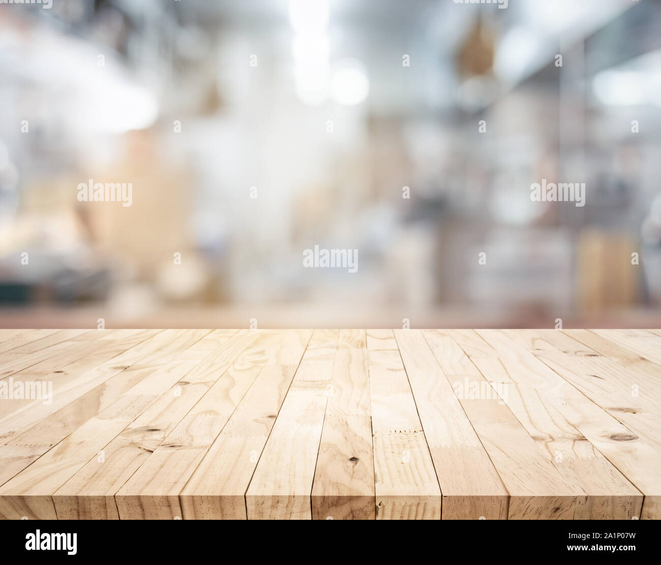 Wood table,counter island on blur kitchen room background.For montage product display or design key visual layout. Stock Photo