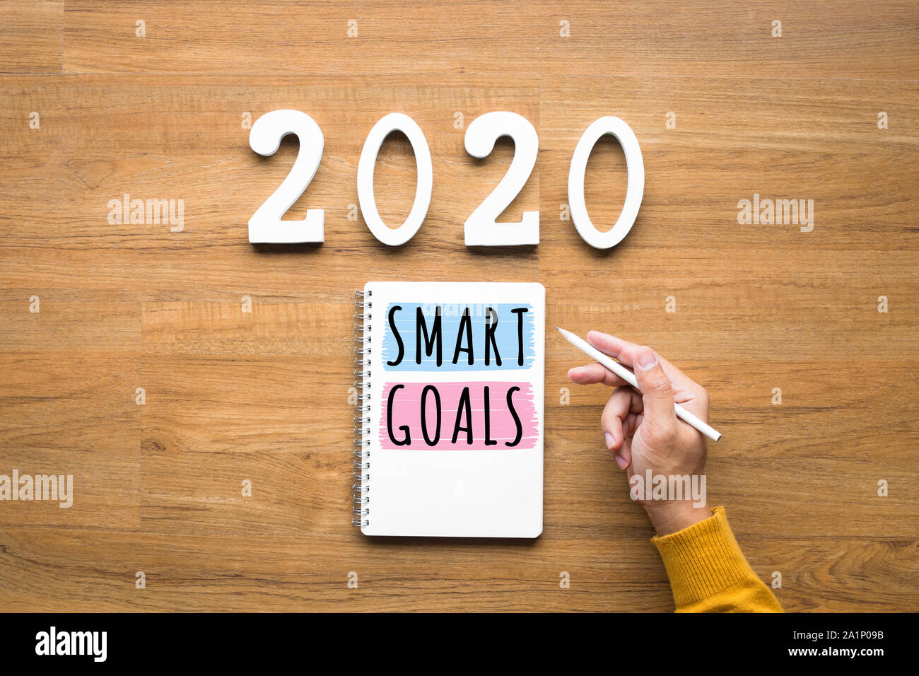 2020, smart goal concepts with notepad and male hand on wood background.Business challenge.Inspiration ideas.Human performance Stock Photo