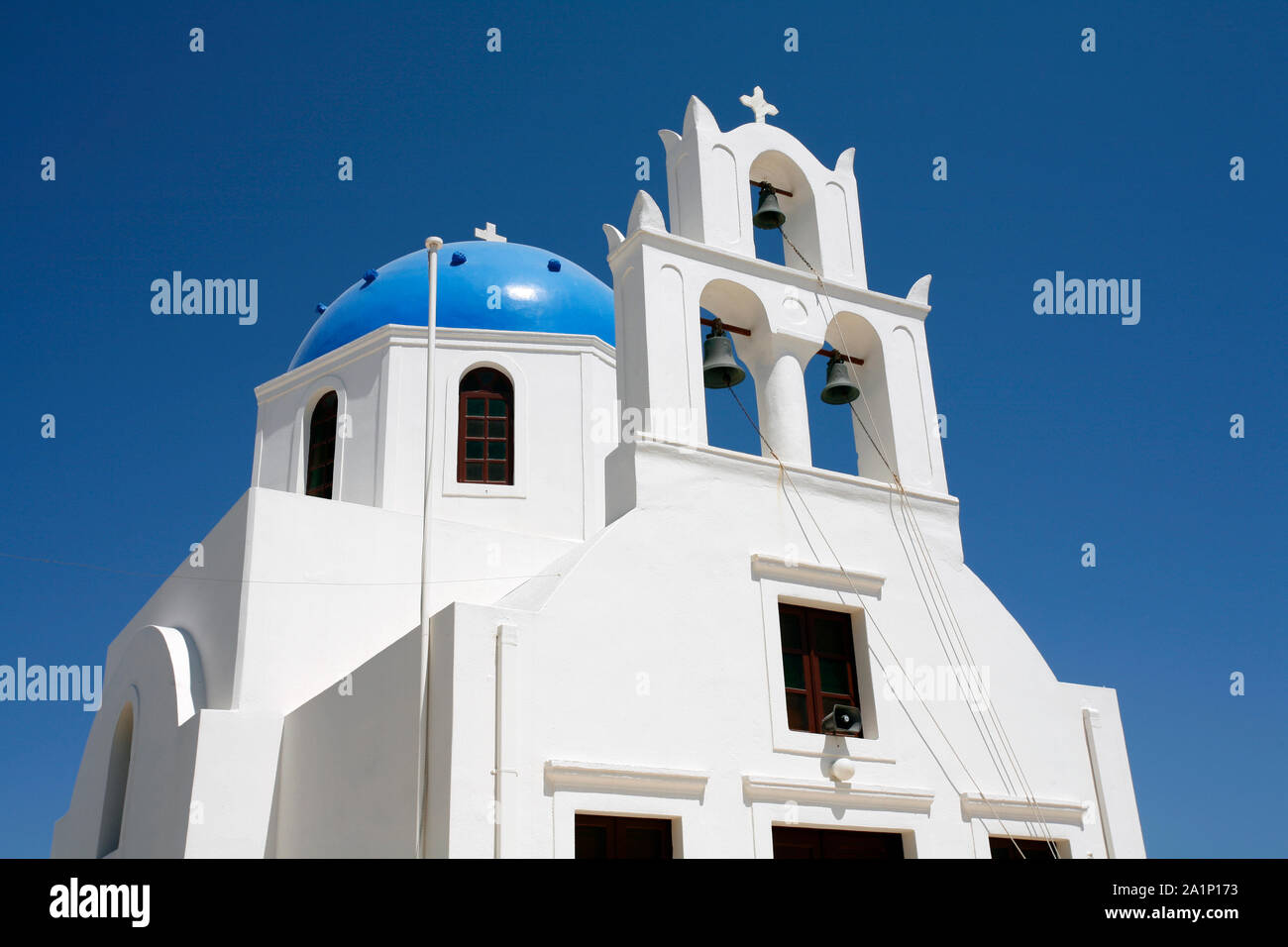 A traditional blue-domed church on the Greek Cycladic island of Santorini Stock Photo