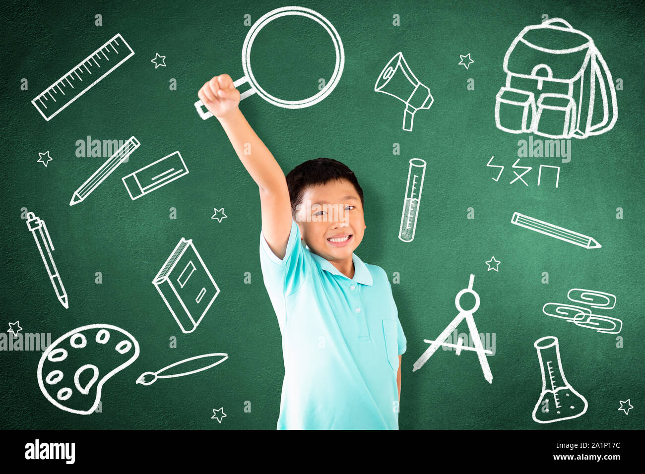 kid standing against chalkboard with education  concept Stock Photo