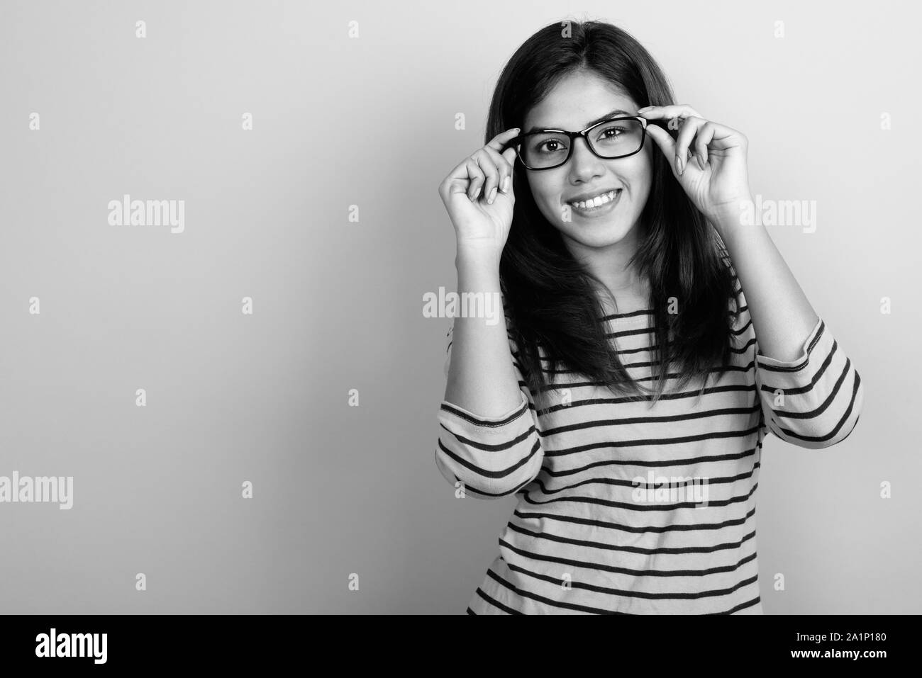 Beautiful indian girl wearing glasses hires stock photography and