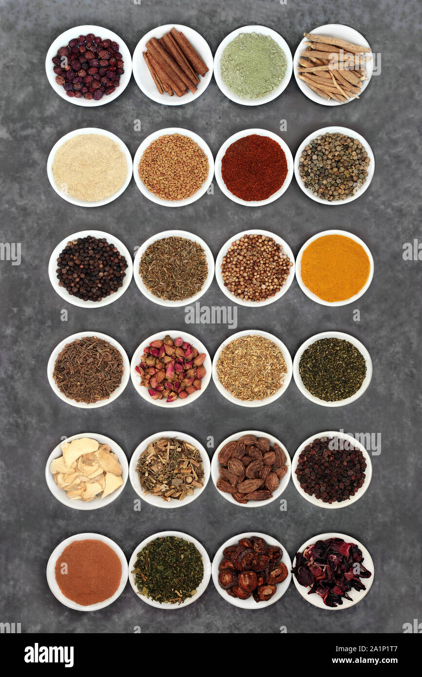 Herbs and spice for a healthy heart and cardiovascular system used in natural and chinese herbal medicine on grey grunge background. Flat lay. Stock Photo