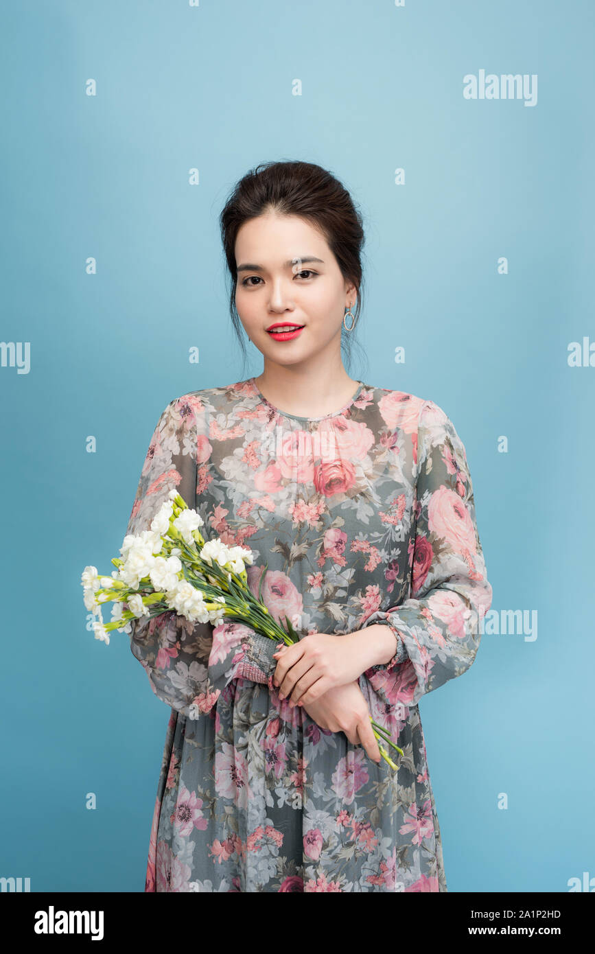 Beautiful elegant woman wearing flower dress Stock Photo - Alamy