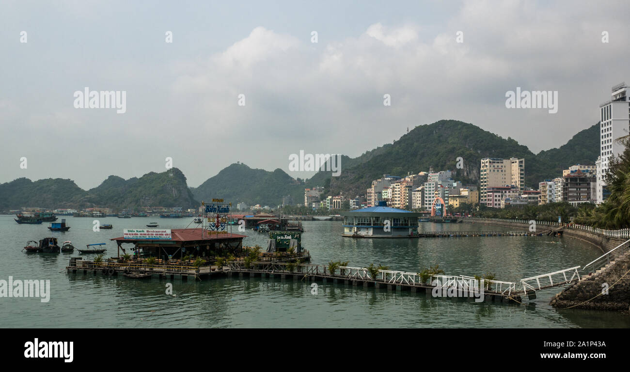 Cityscape of Cat Ba town and bay with floating restaurants, Cat Ba island, Vietnam Stock Photo